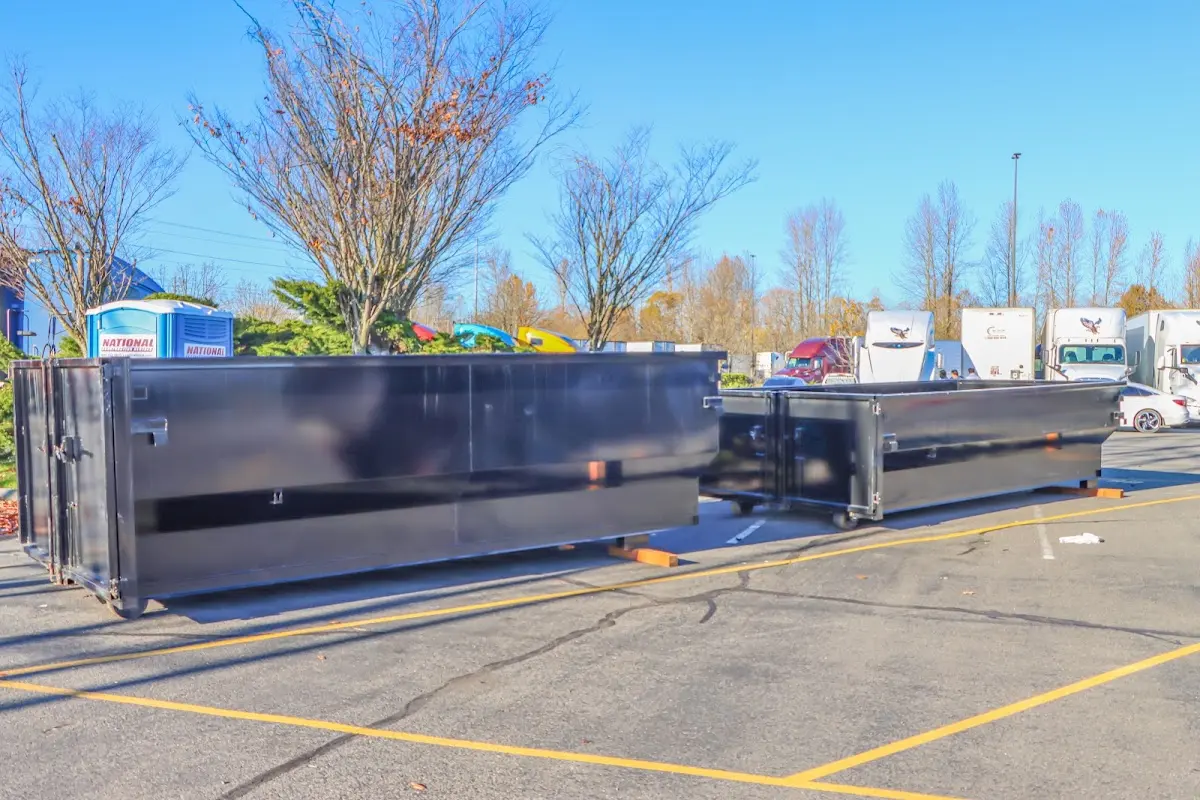 Professional dumpster rental service with roll-off container on residential driveway in Salt Lake City